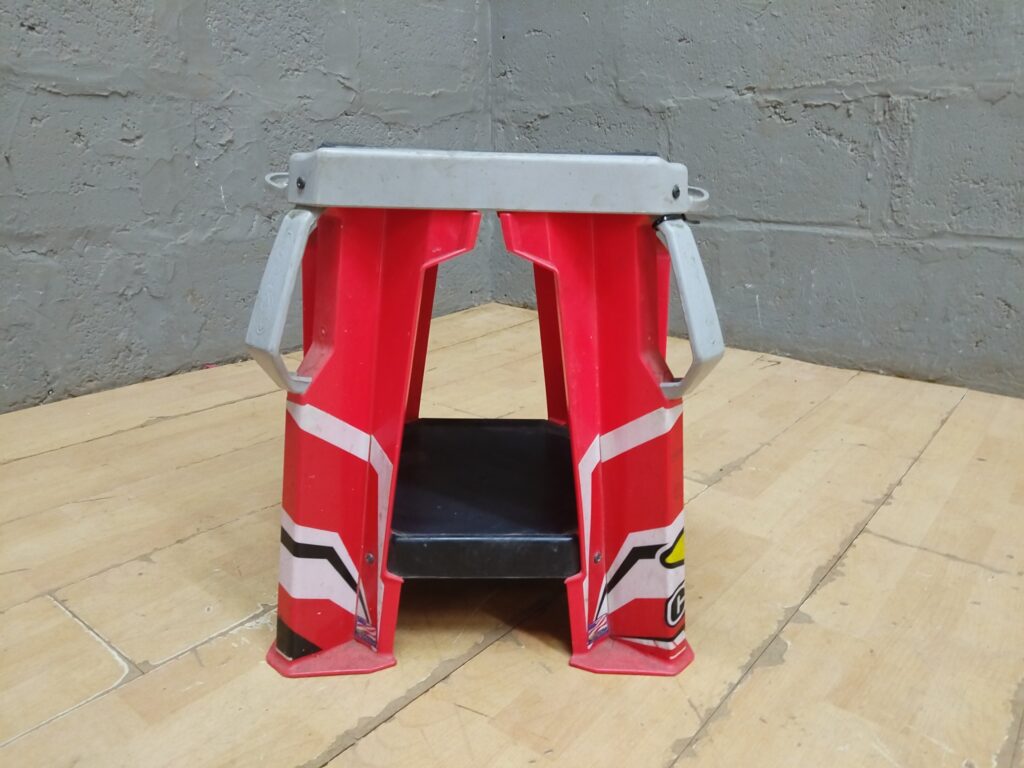 Cycra plastic motorcycle / dirt‑bike pit stand — used, branded top pad, sturdy plastic legs