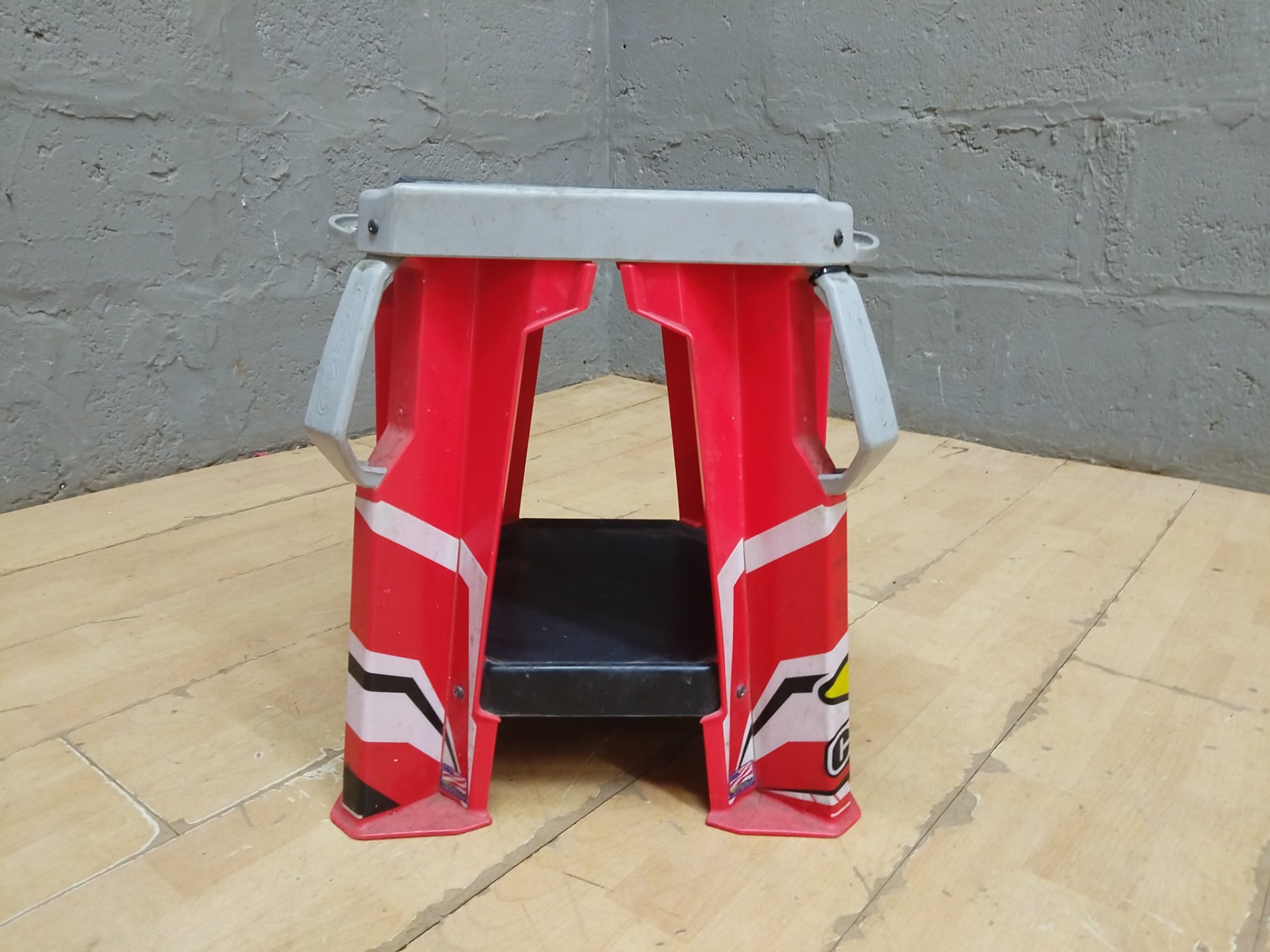 Cycra plastic motorcycle / dirt‑bike pit stand — used, branded top pad, sturdy plastic legs