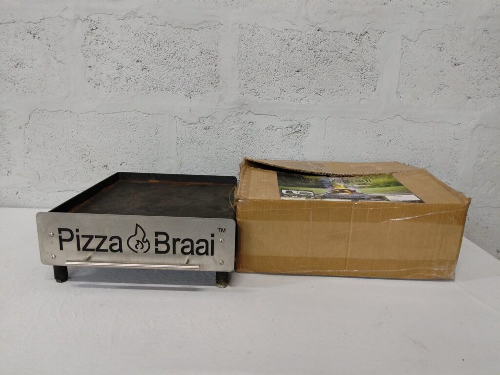 Pizza Braai outdoor pizza oven — main body only, heavy surface rust, original box included (crushed) — Untested