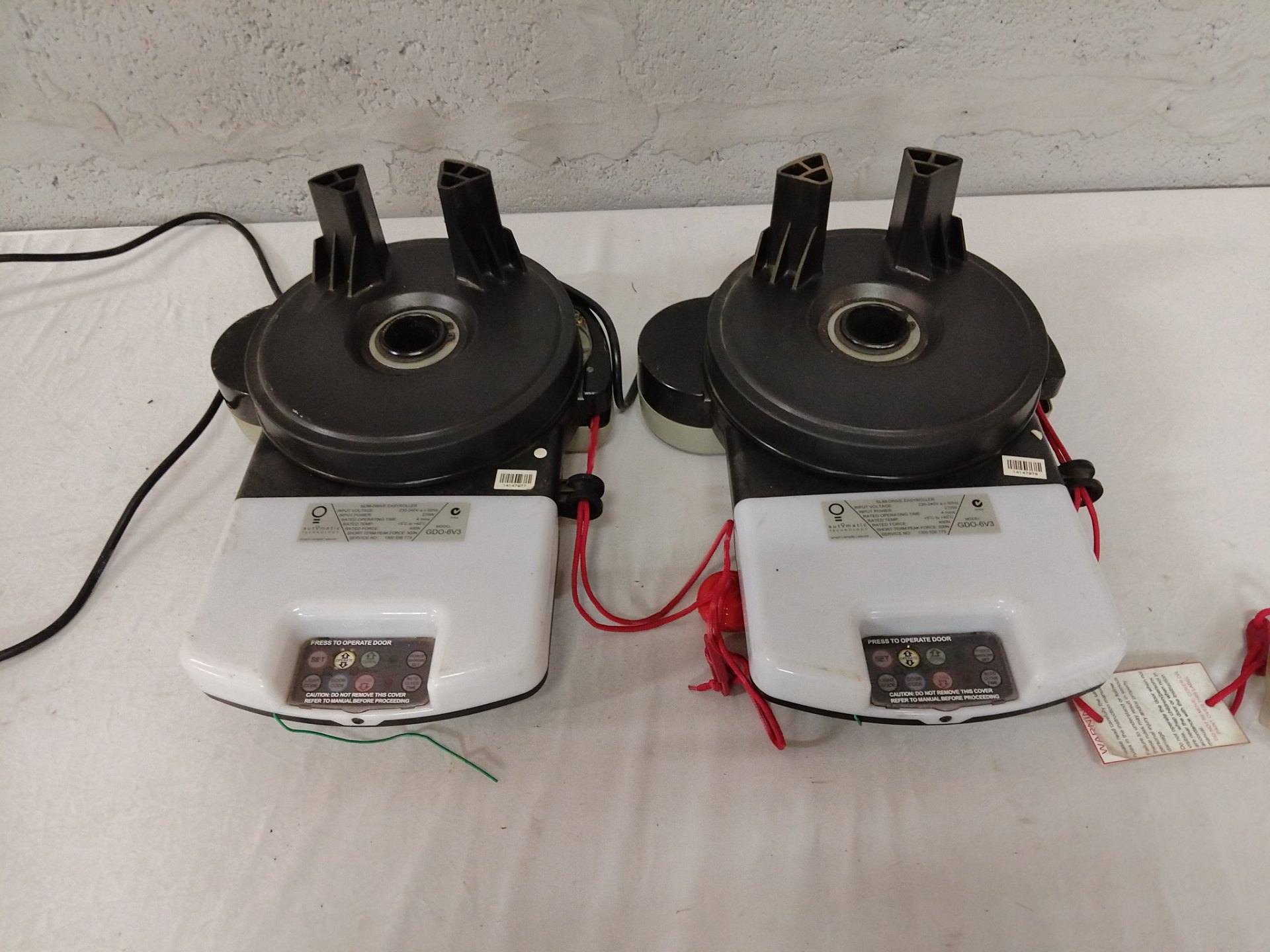 Pair Automatic GDO-6V3 Slim-Drive Slide/Swing Door Operators — tested working, mounting brackets & emergency cords