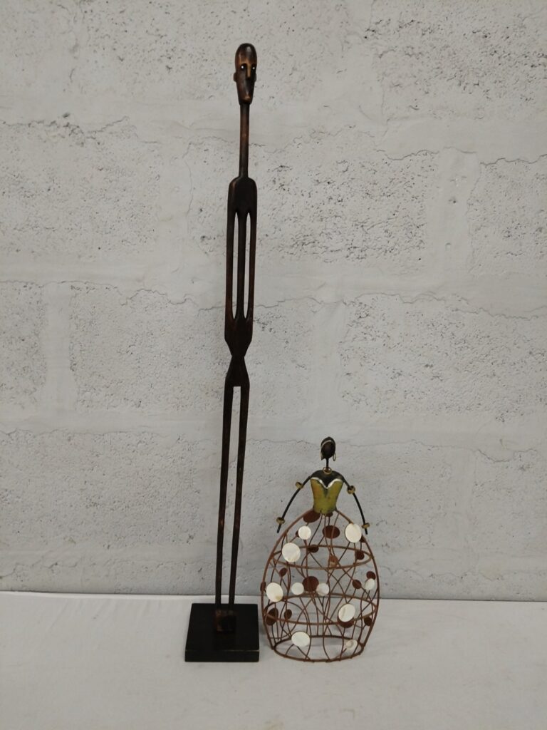 Pair of decorative sculptures – tall 94 cm wooden figure on fixed square base + 35 cm wire & shell skirt figure