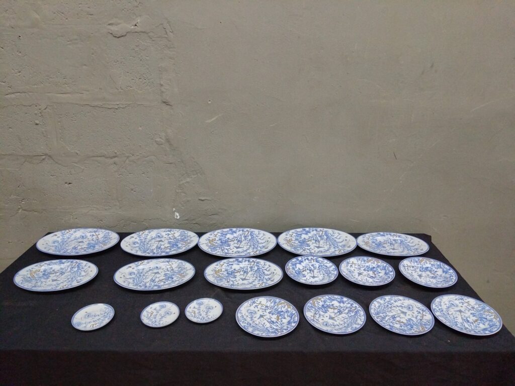 Victoria blue & white transferware dinner set — 18 pieces (plates & oval platters) with gilt detail