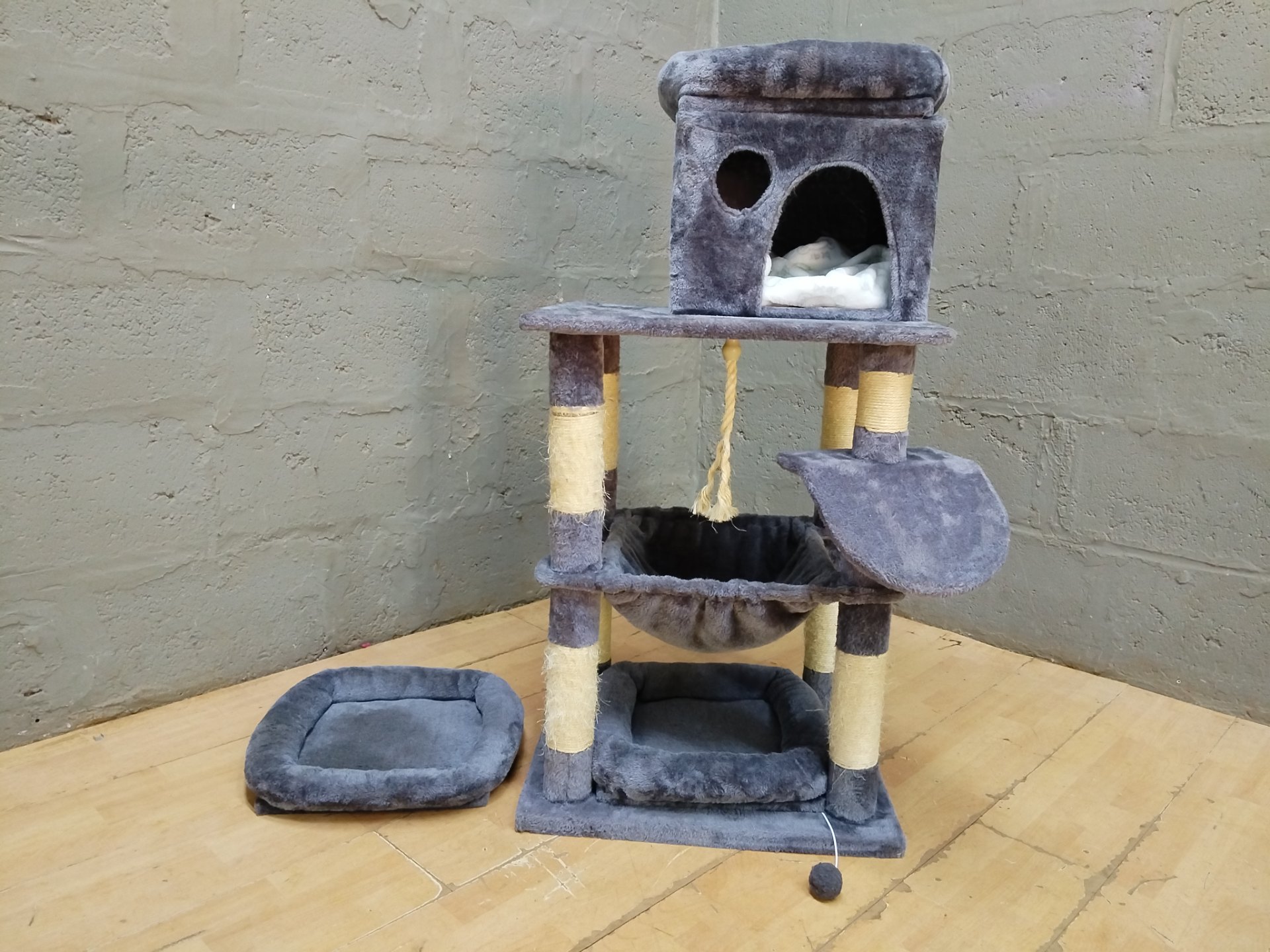 Grey multi-level cat tree with cubby, hammock, toys and removable cushions — used, worn sisal