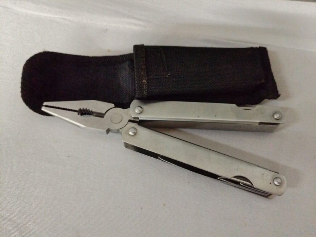 Unbranded Folding Multitool with Pliers + Black Nylon Belt Sheath — Working, Light Wear