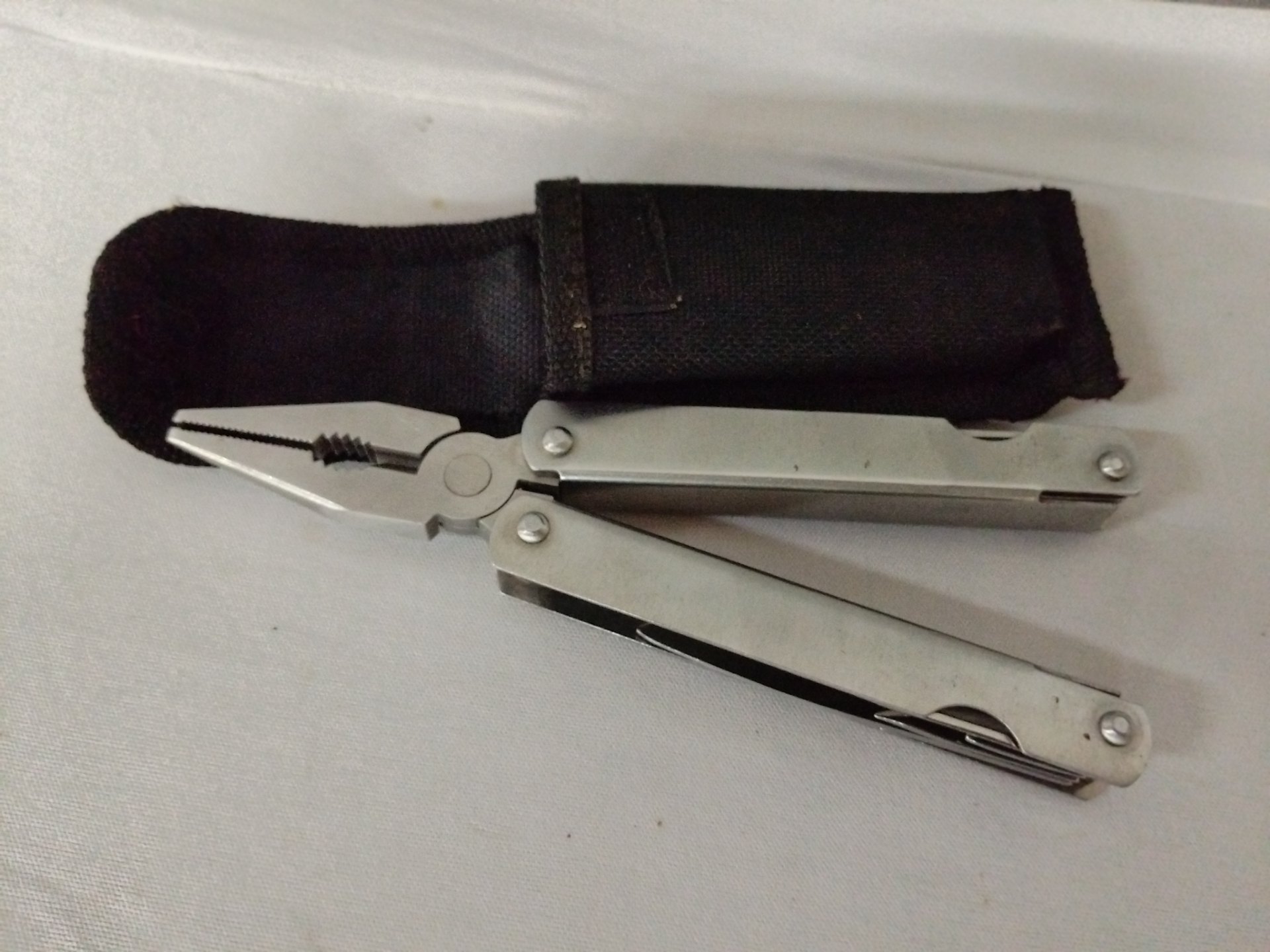 Unbranded Folding Multitool with Pliers + Black Nylon Belt Sheath — Working, Light Wear