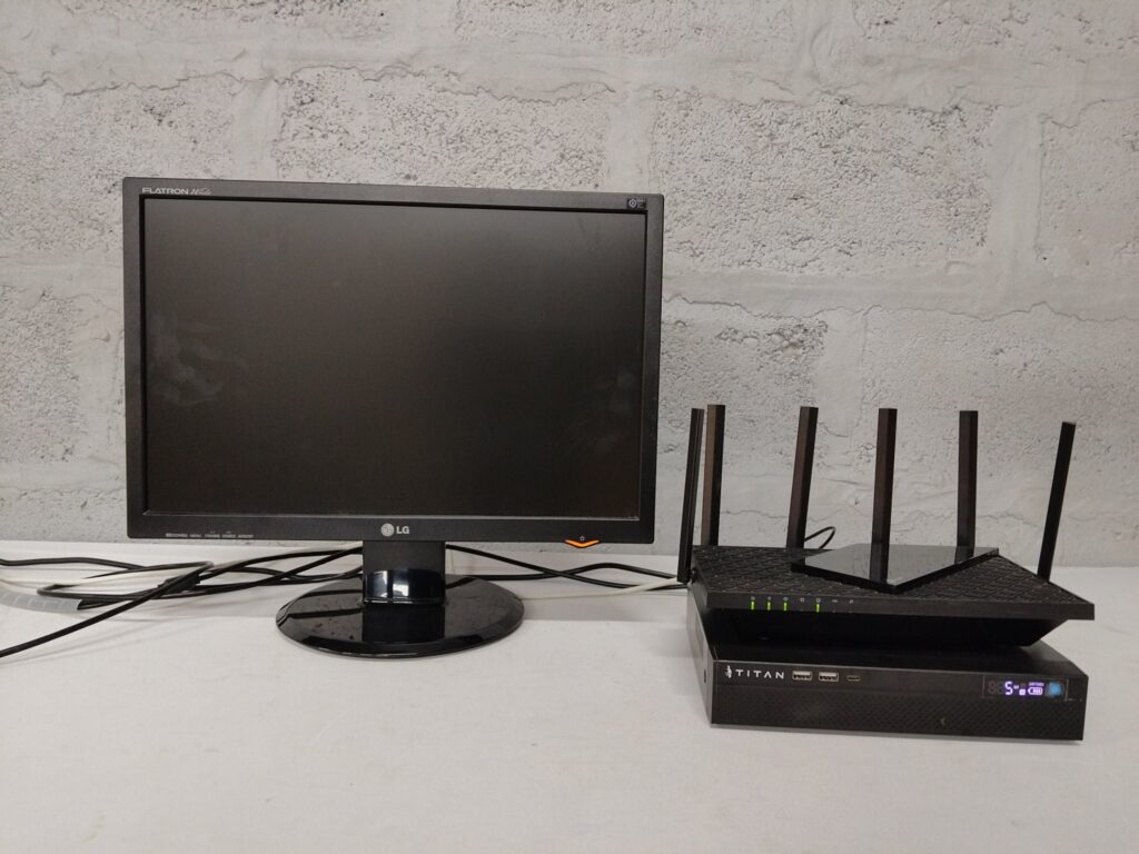 Lot: LG Flatron L206WTQ monitor + TP‑Link Archer AX73 (AX5400 Wi‑Fi6) router + TITAN TTT‑NPS8012 mini UPS — tested working