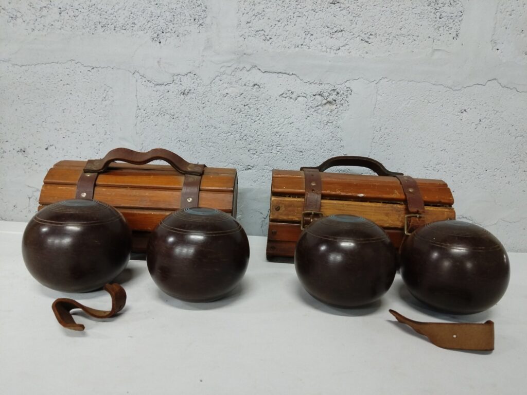 Vintage wooden lawn bowls set — 4 bowls with 2 wooden slatted carrying cases (used, worn straps)