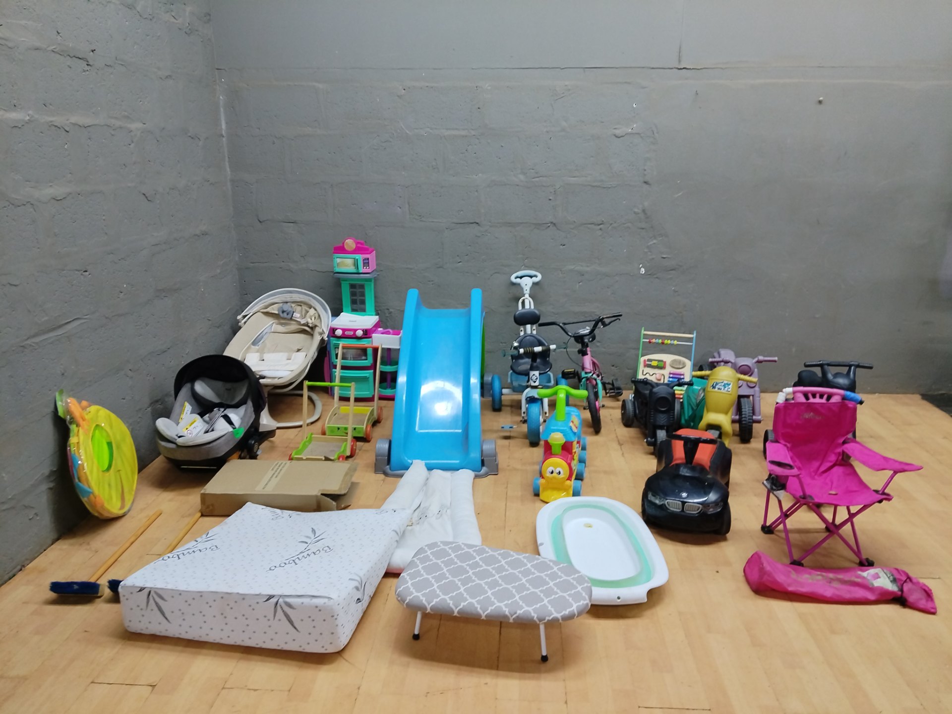 Bulk mixed children’s toys & baby equipment — slide, ride-ons, car seats, bath + accessories (used)