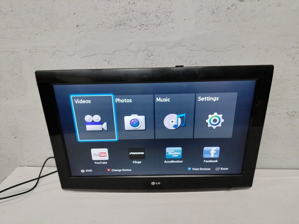 LG TV (80 x 56 cm) — Powers On, Smart menu visible, Power Cable Included, Cosmetic Bezel Wear
