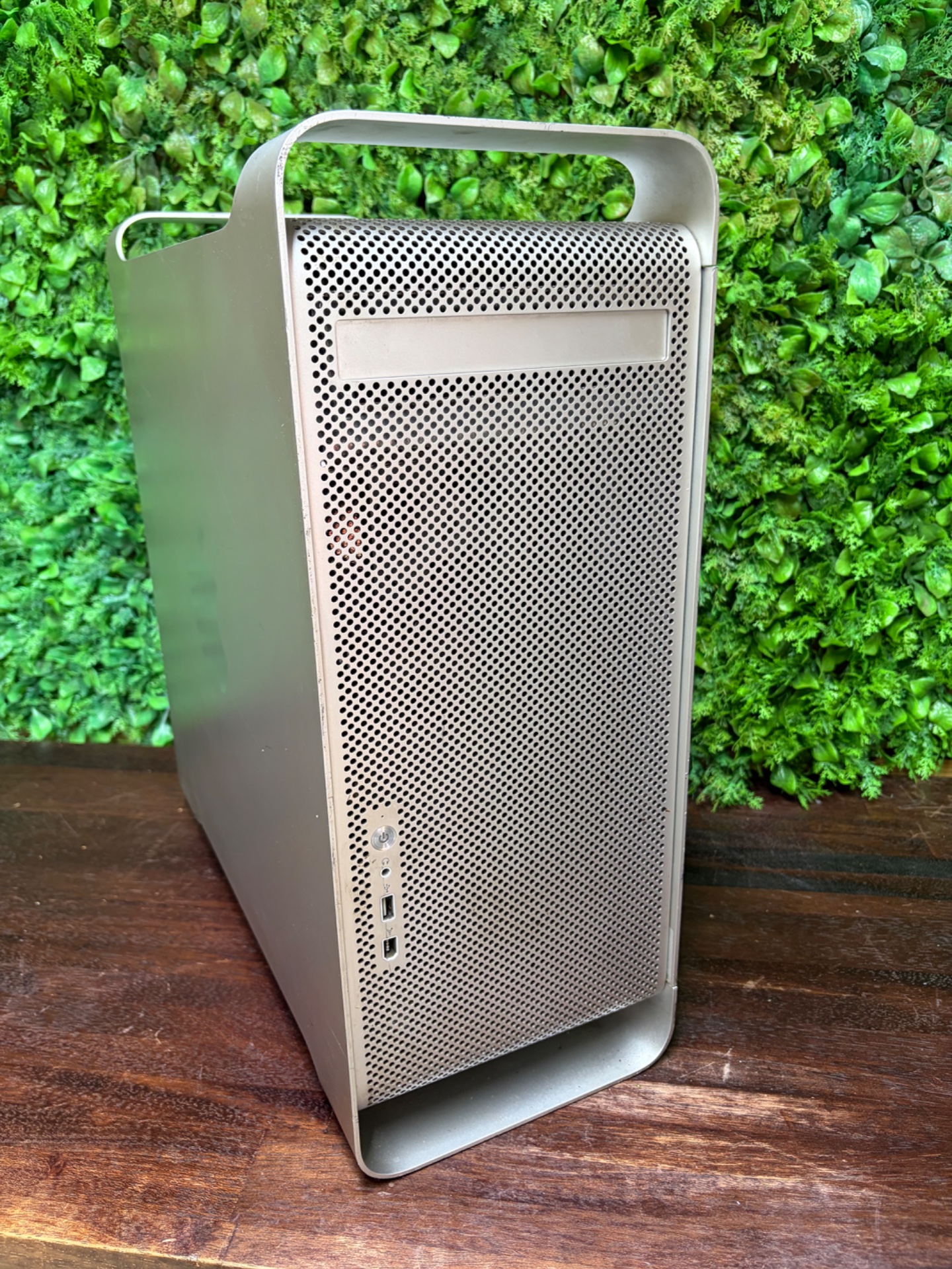 Apple Mac Pro tower (cheese-grater) — Apple logo visible, exterior cosmetic wear, untested