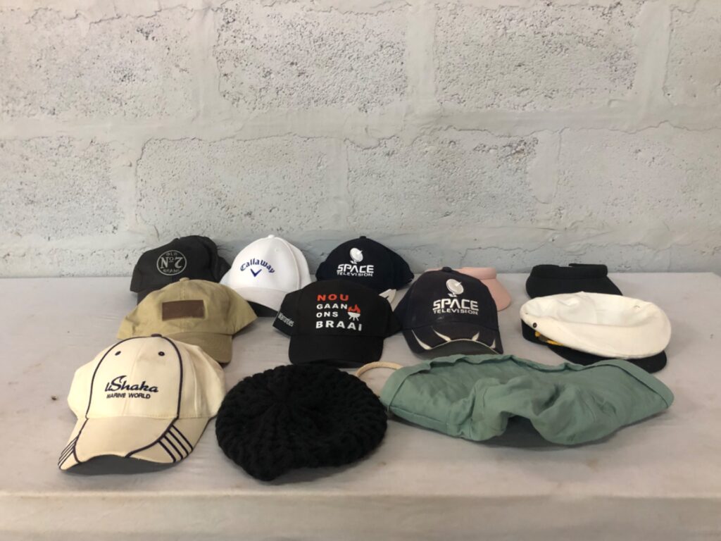 Lot of 12 assorted used caps, visors, beanies and bucket hat — mixed branded casual headwear