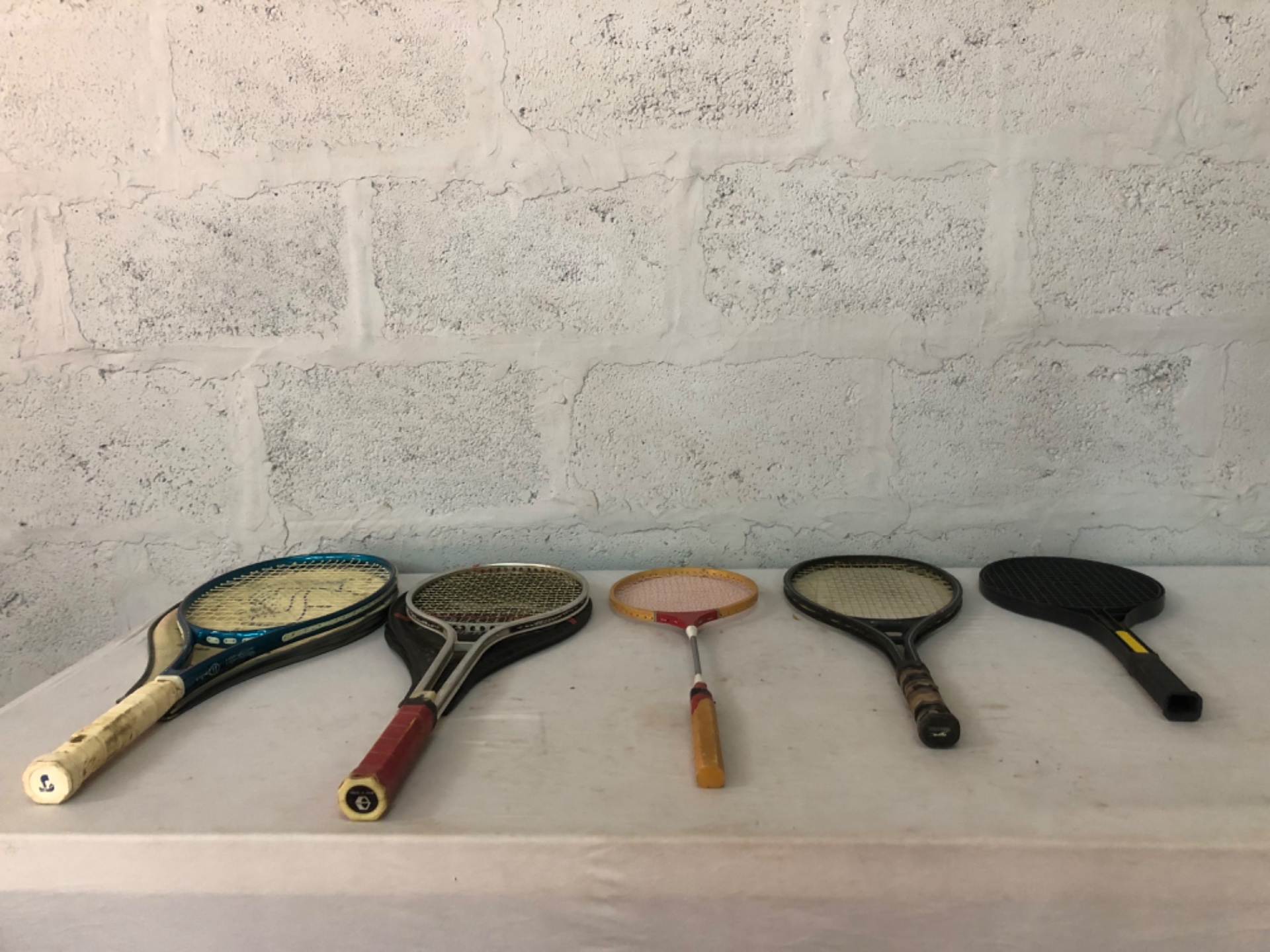 Lot of 5 used mixed tennis/badminton rackets (Slazenger + Orbit visible) — assorted grips, cover included