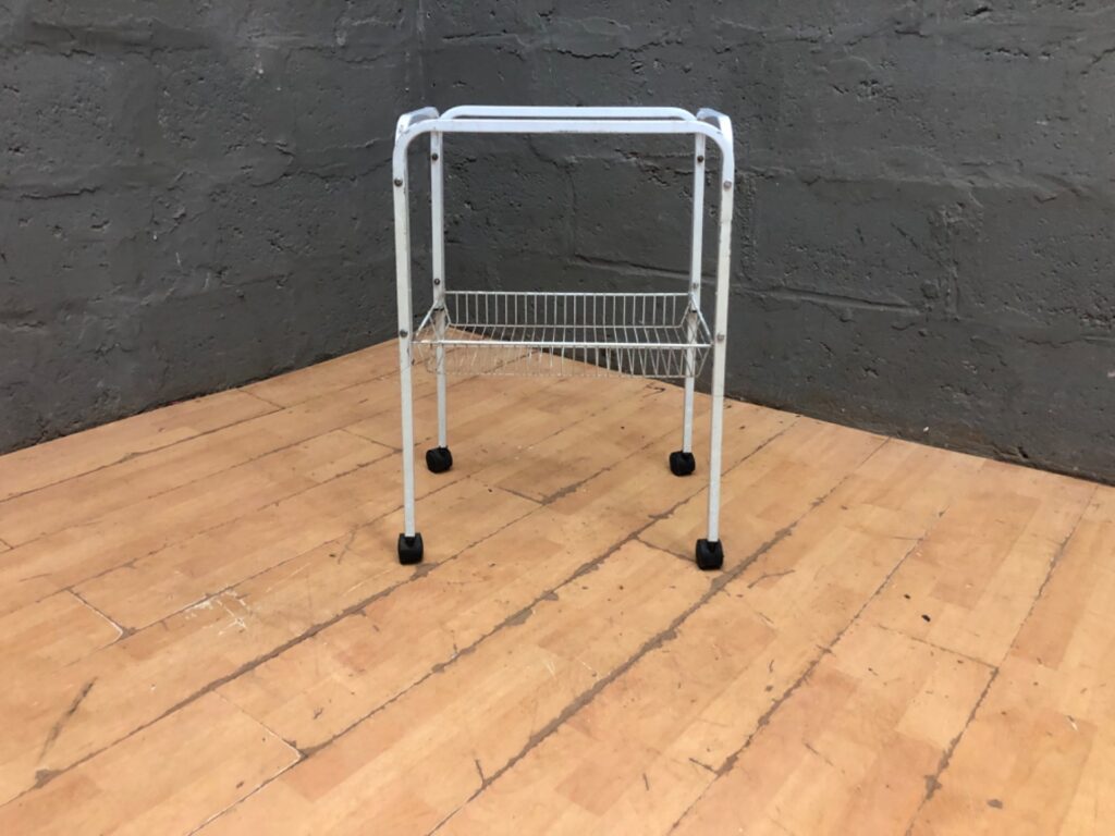 White metal rolling storage cart with single wire basket — 70 x 35 x 46 cm