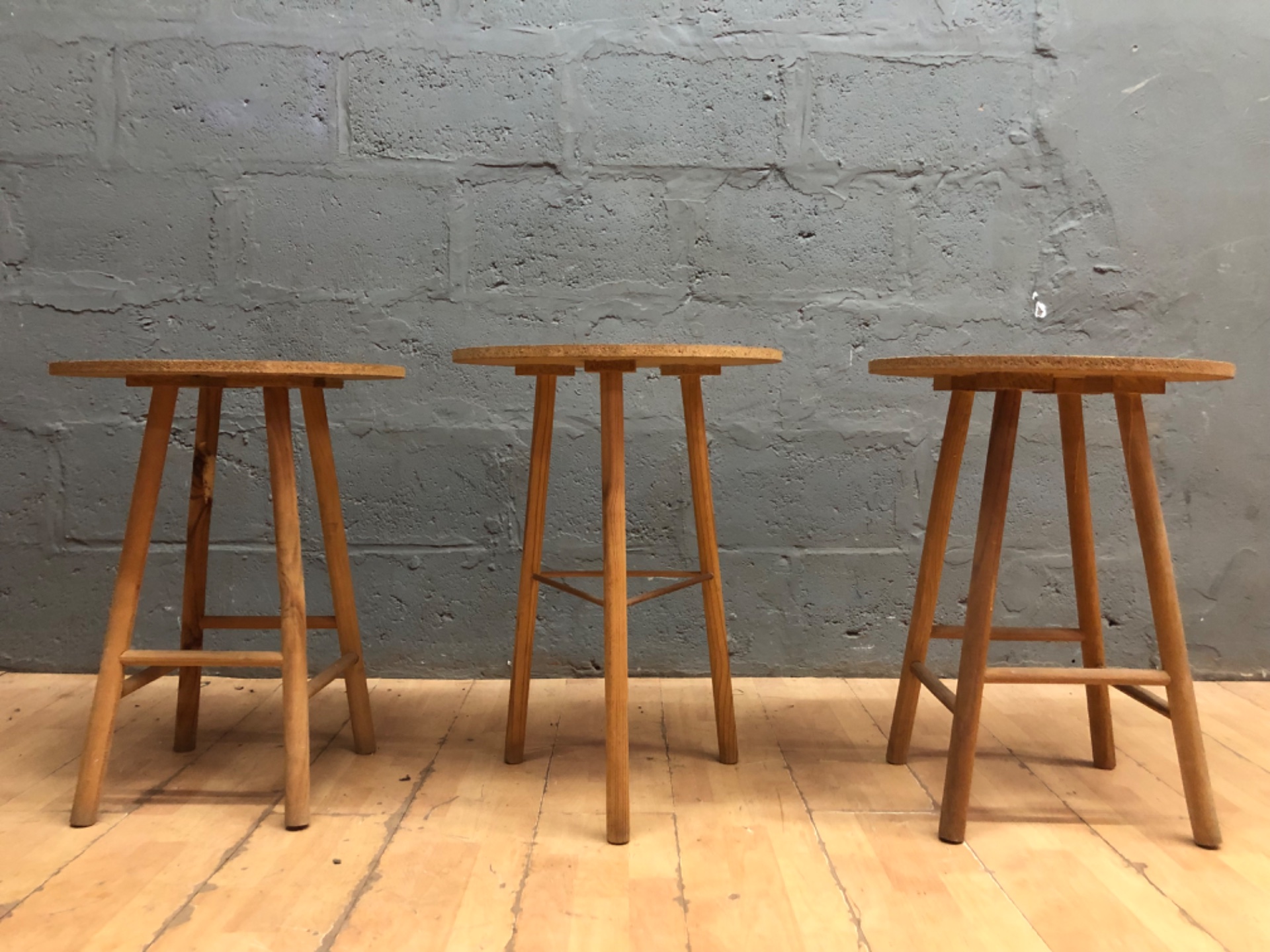 Set of 3 rustic wooden stools — 68 cm high, 50 cm particleboard tops, worn but solid