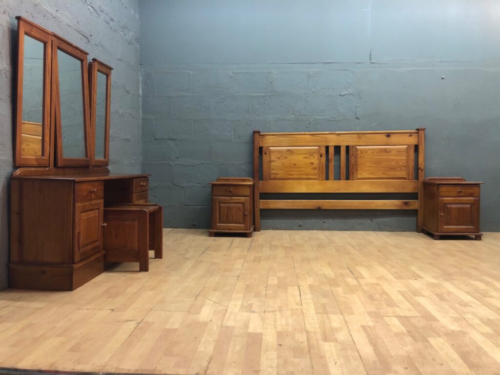 Pine bedroom suite — headboard, dressing table with tri-fold mirror, stool & 2 bedside cabinets (used, serviceable)