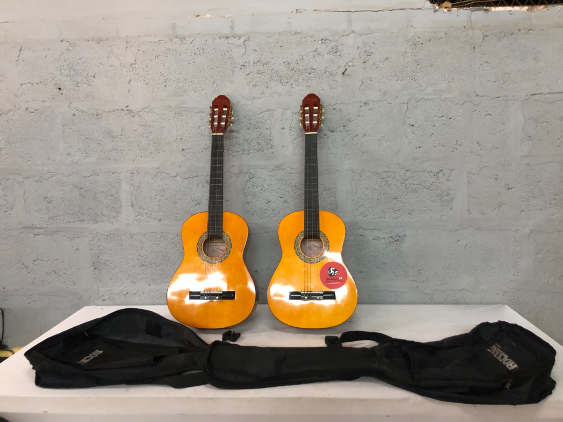 Pair of Santa Fe 3/4 classical (nylon) guitars — student size, tested playable; RockBag + 2 RockTuner CT7s