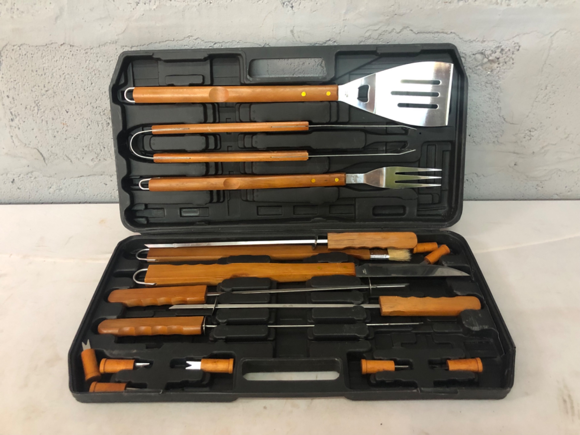 17-piece BBQ utensil set in fitted plastic carry case — wooden handles, used