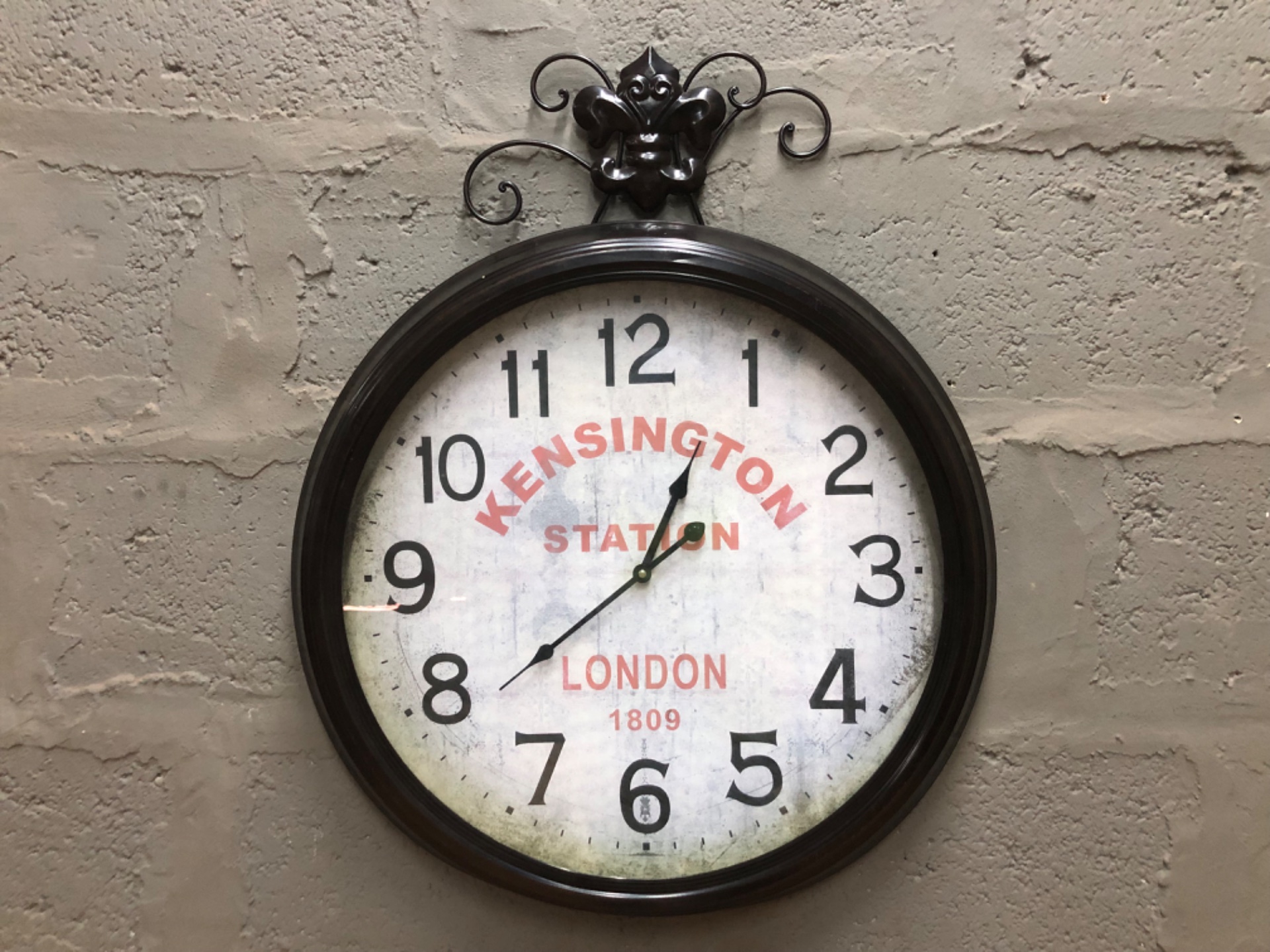 Kensington Station decorative wall clock — ornate metal topper, 61 cm, warehouse-tested working (no battery)