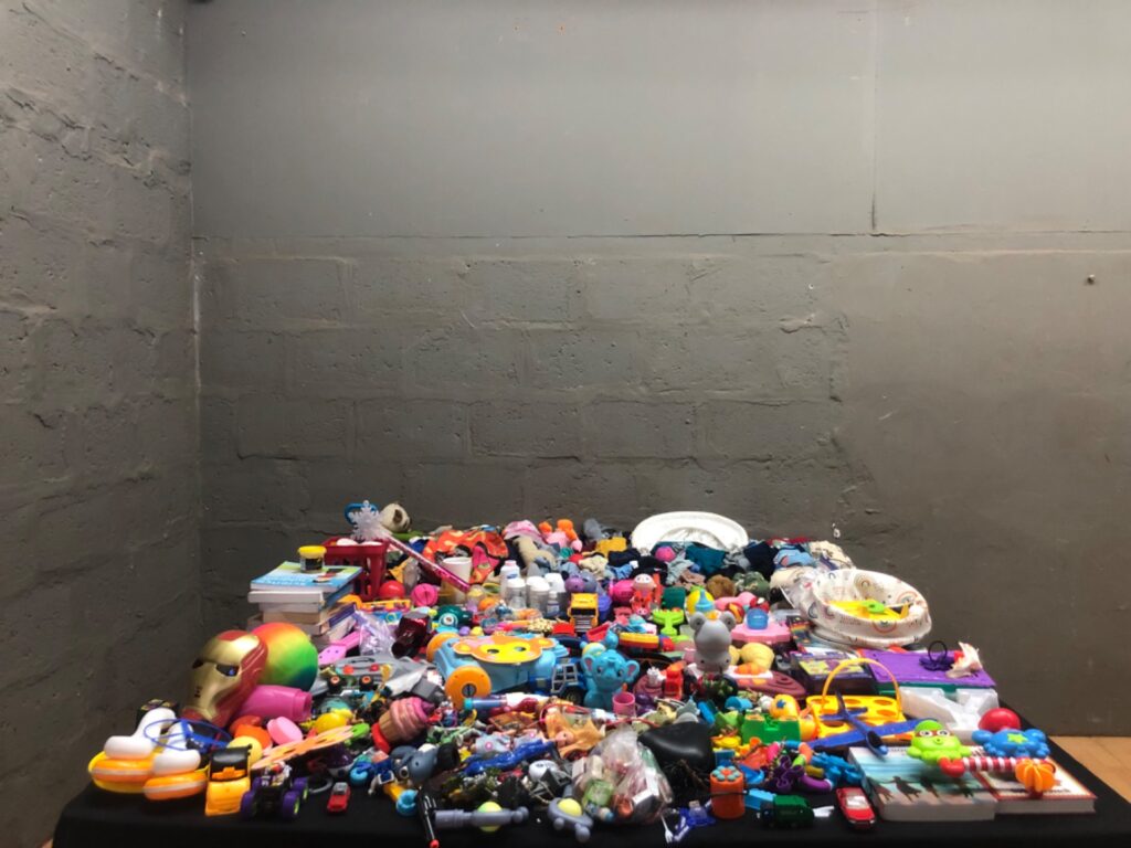 Bulk mixed children’s toys & baby clothing — assorted plush, plastic toys, cars, rattles; batteries included