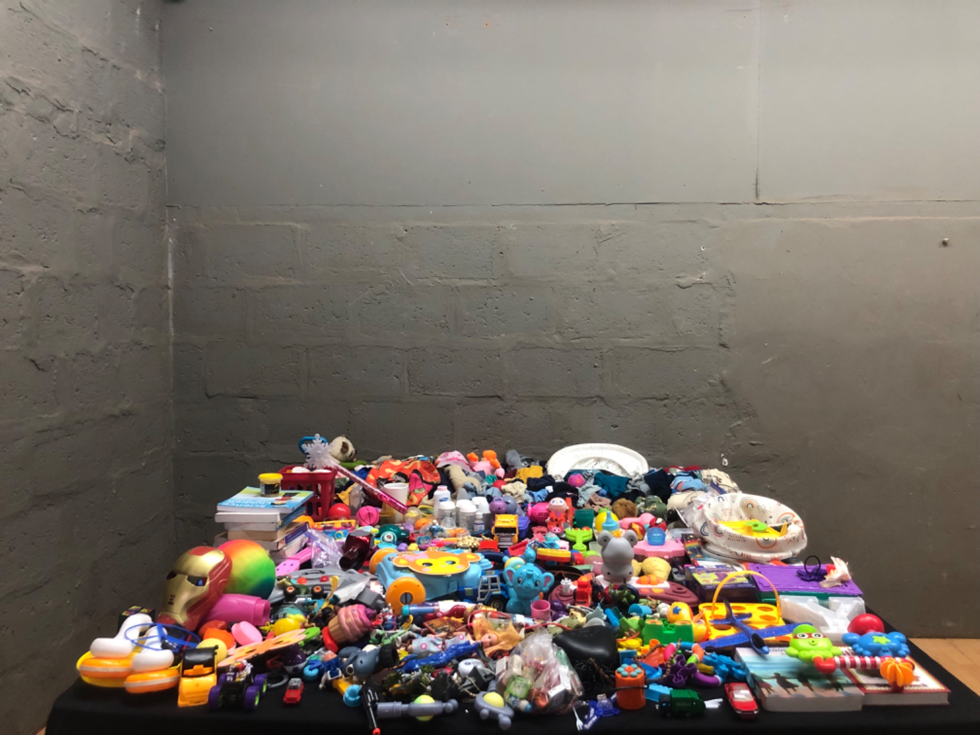 Bulk mixed children’s toys & baby clothing — assorted plush, plastic toys, cars, rattles; batteries included