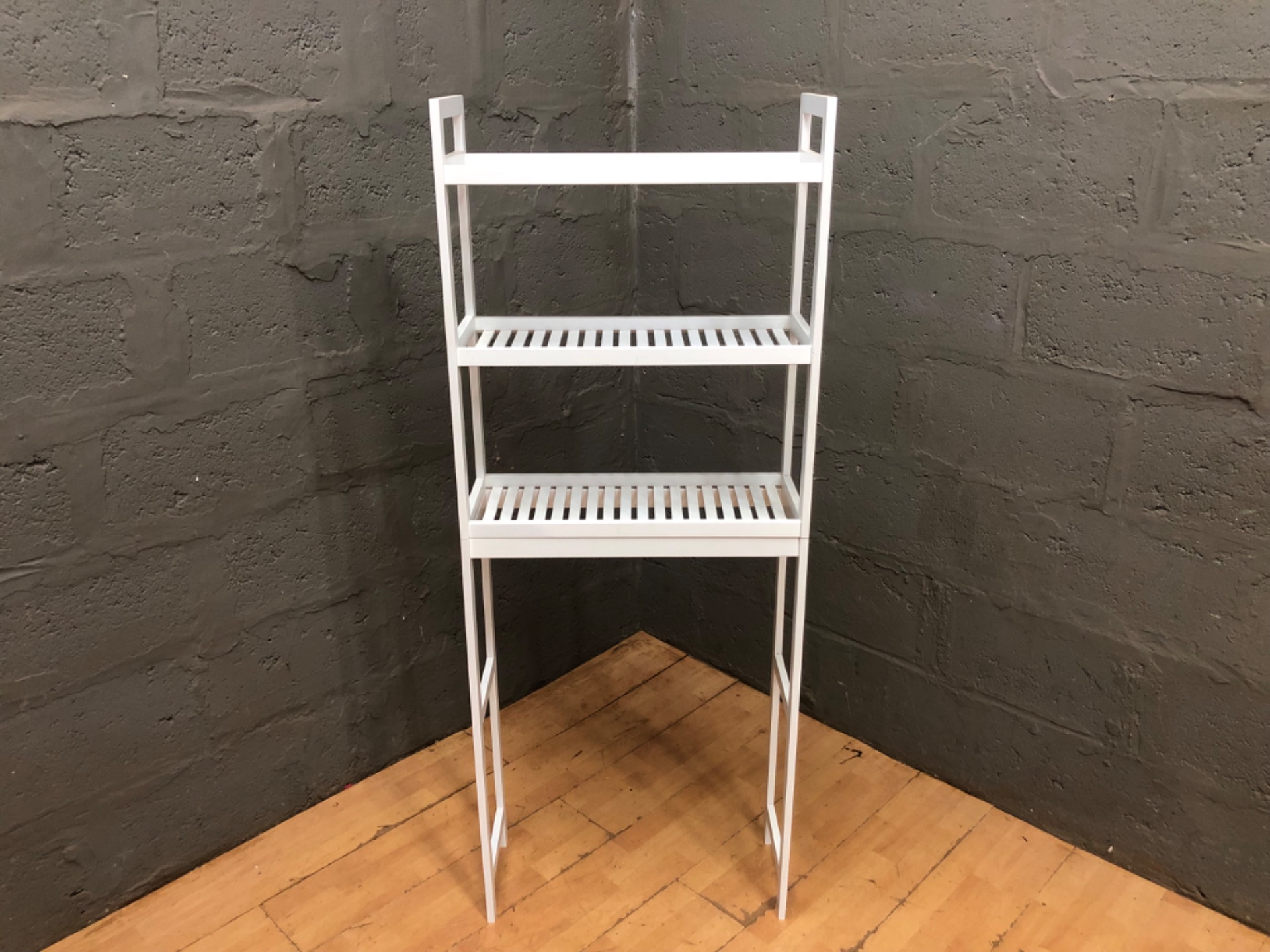White three-tier freestanding slatted shelving unit — slim over-toilet / bathroom-style storage (163 x 26 x 63 cm)