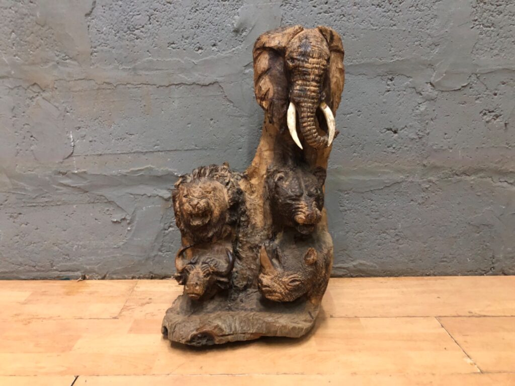 Hand-carved root wood multi-animal sculpture — elephant, lion, rhino, buffalo (59 × 13 × 29 cm)
