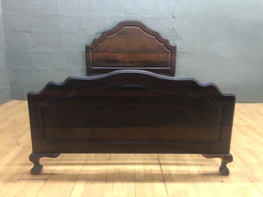 Double vintage-style wooden bed frame with sprung metal base — headboard + footboard