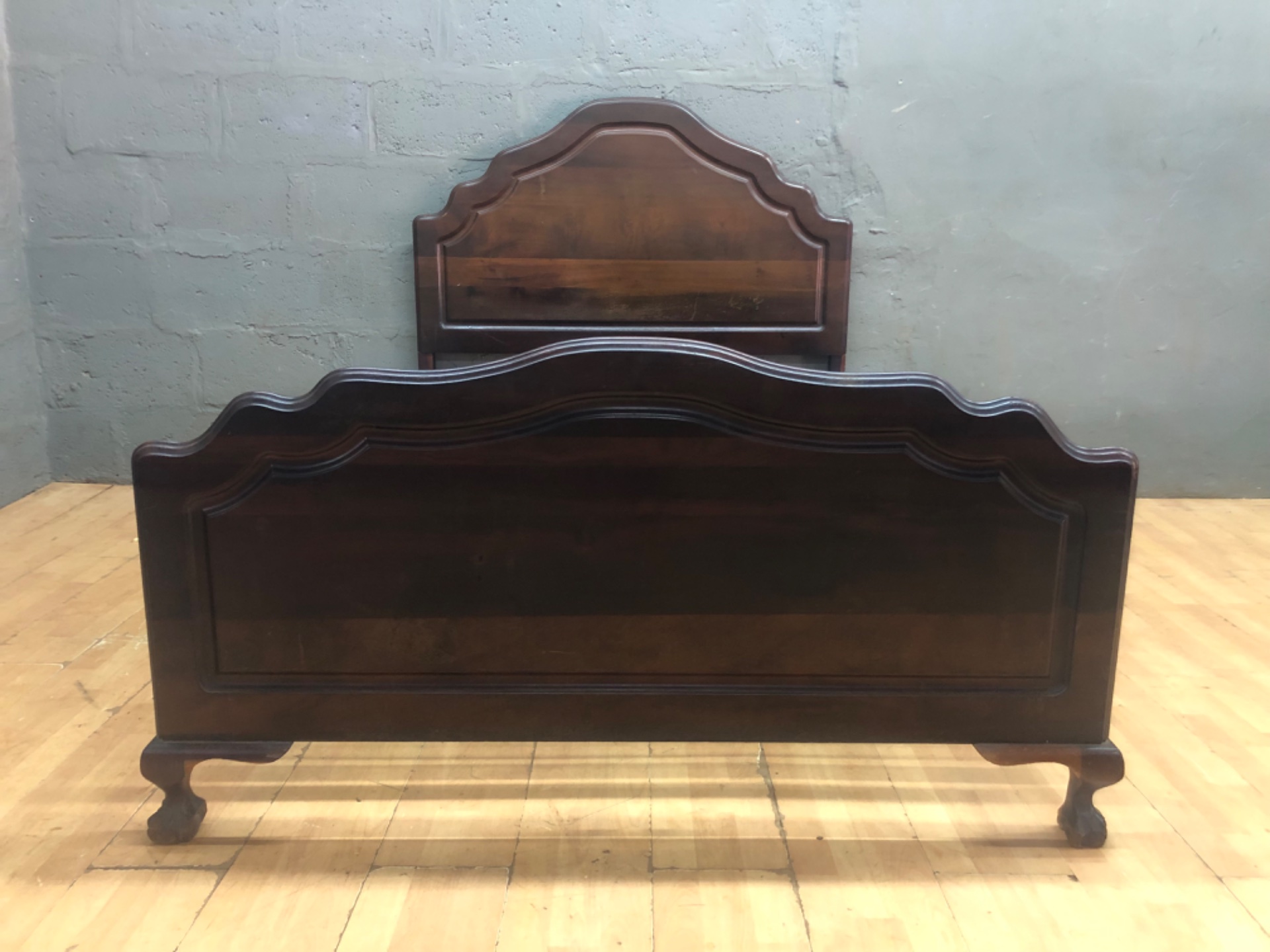 Double vintage-style wooden bed frame with sprung metal base — headboard + footboard