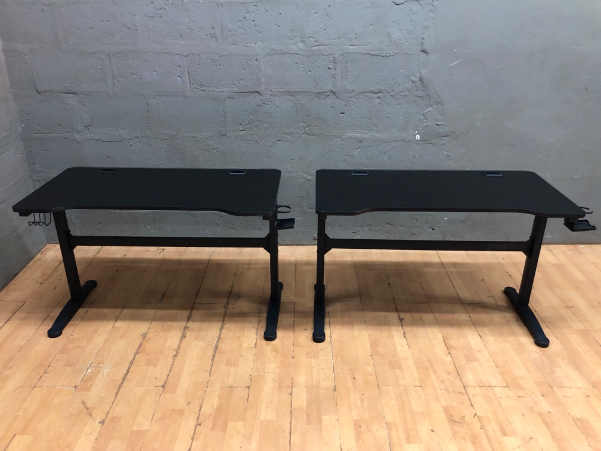 Pair of manual height-adjustable sit/stand office desks — 120 x 62 cm (75 cm) — black, used