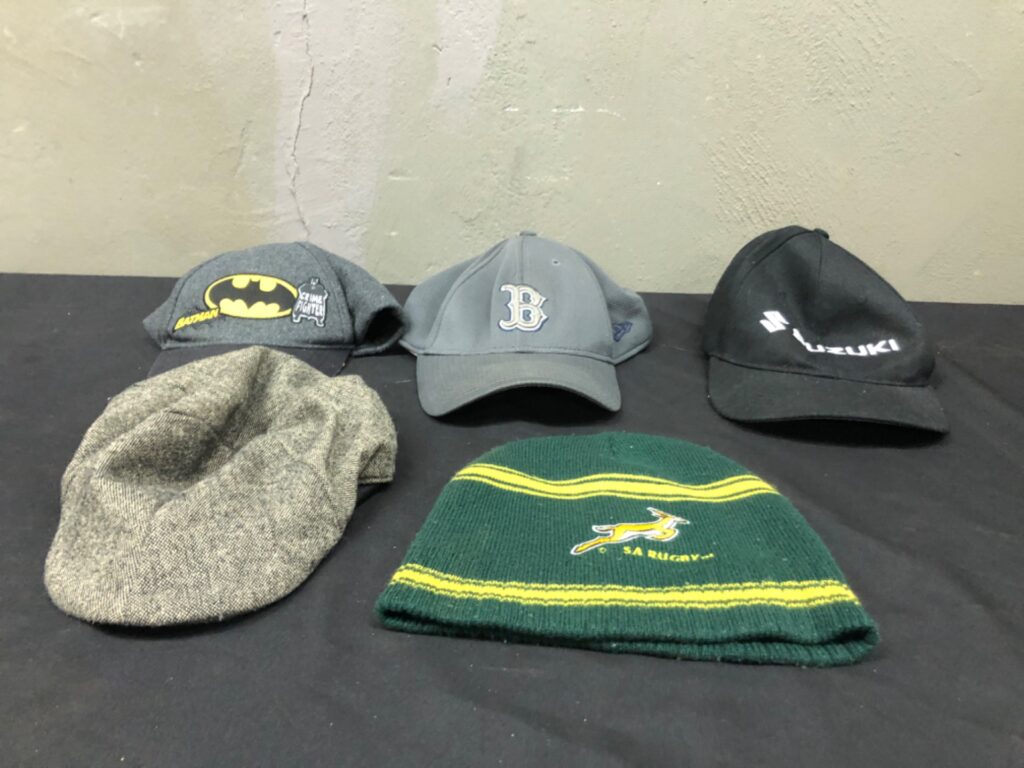 Mixed lot of 5 used caps & beanies — Batman patch, New Era 39THIRTY ‘B’ cap, Suzuki cap, SA Rugby beanie, grey flat cap