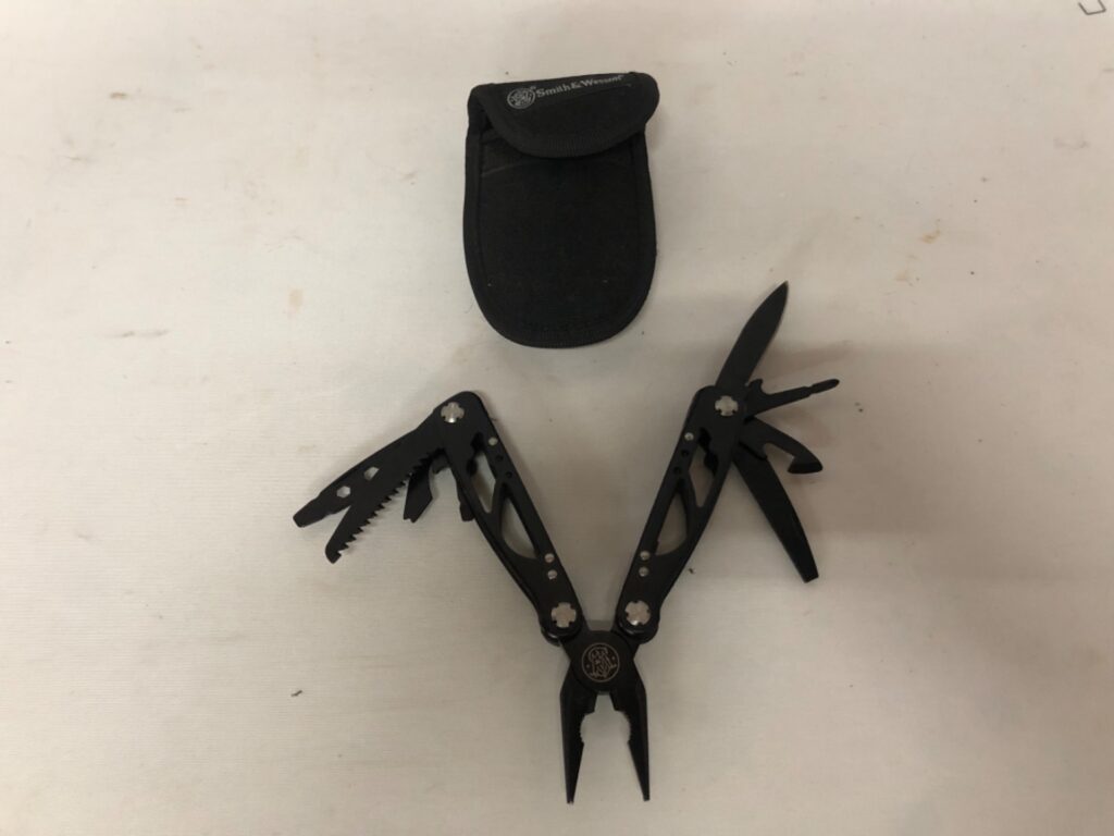 Smith & Wesson Black Multi‑Tool with Nylon Pouch — Working, Light Wear