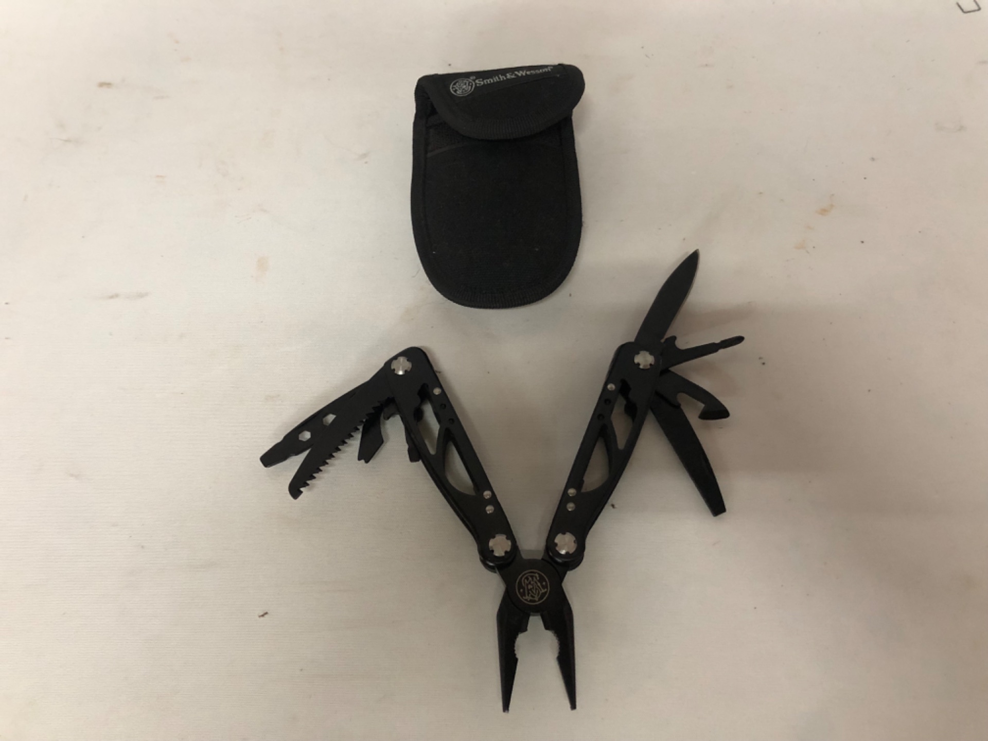 Smith & Wesson Black Multi‑Tool with Nylon Pouch — Working, Light Wear