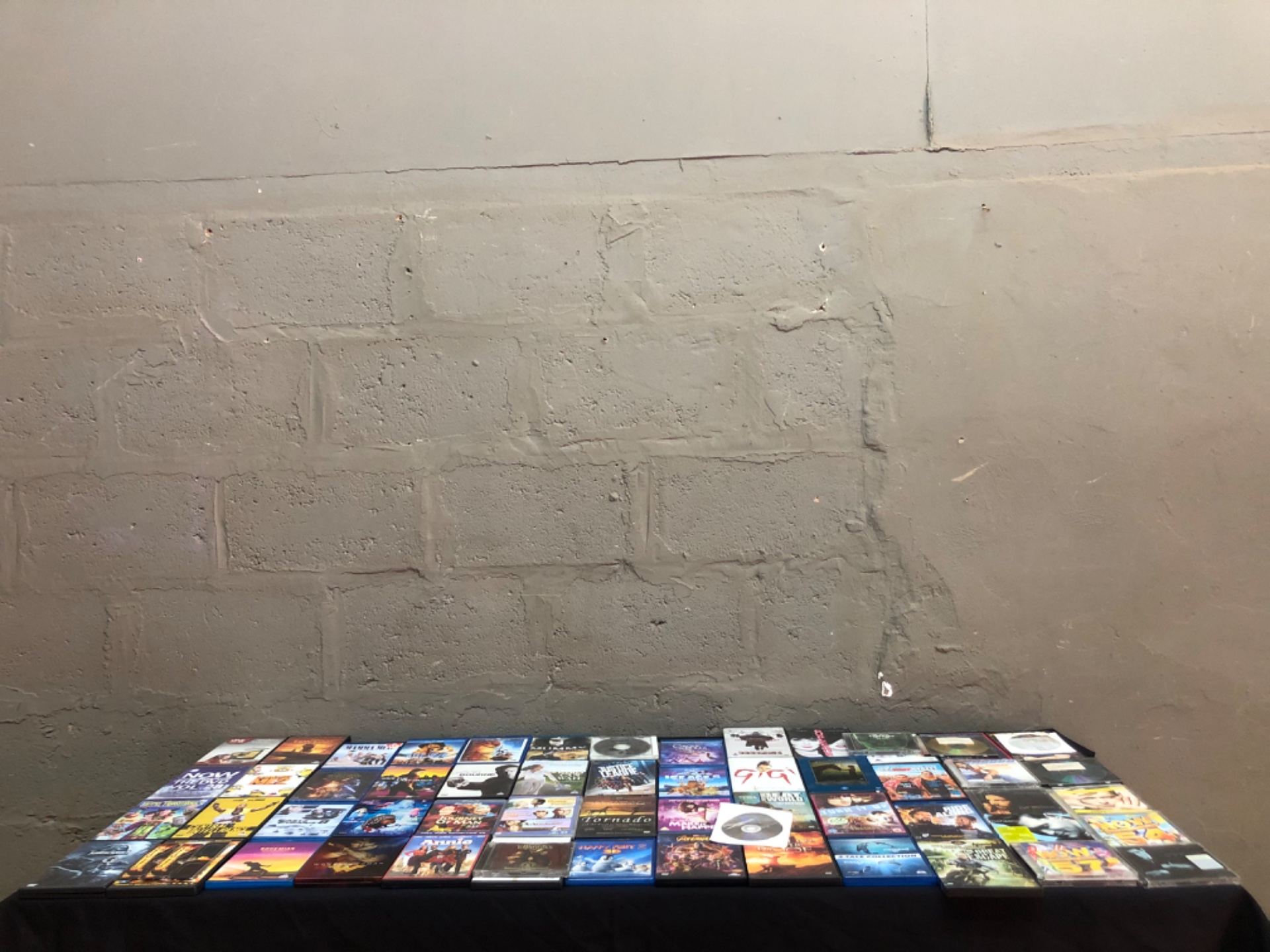 Mixed lot 64 DVDs, Blu‑rays & CDs — Popular movie titles (Jurassic World, Wonder Woman, Bohemian Rhapsody etc.)