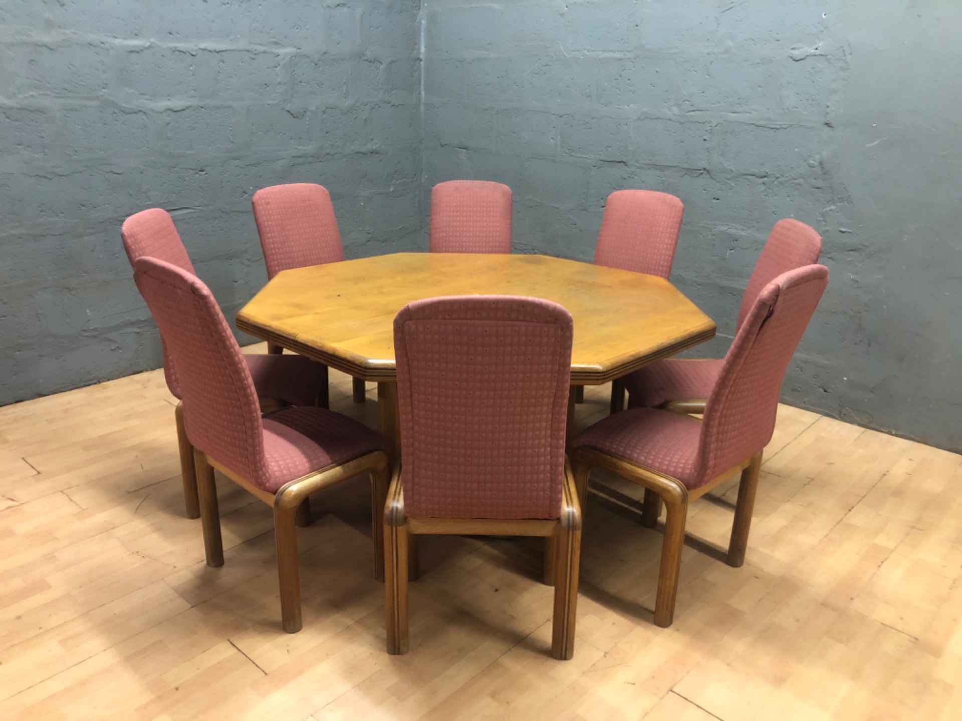 Octagonal extension dining table with central leaf + 8 matching upholstered chairs — used, worn