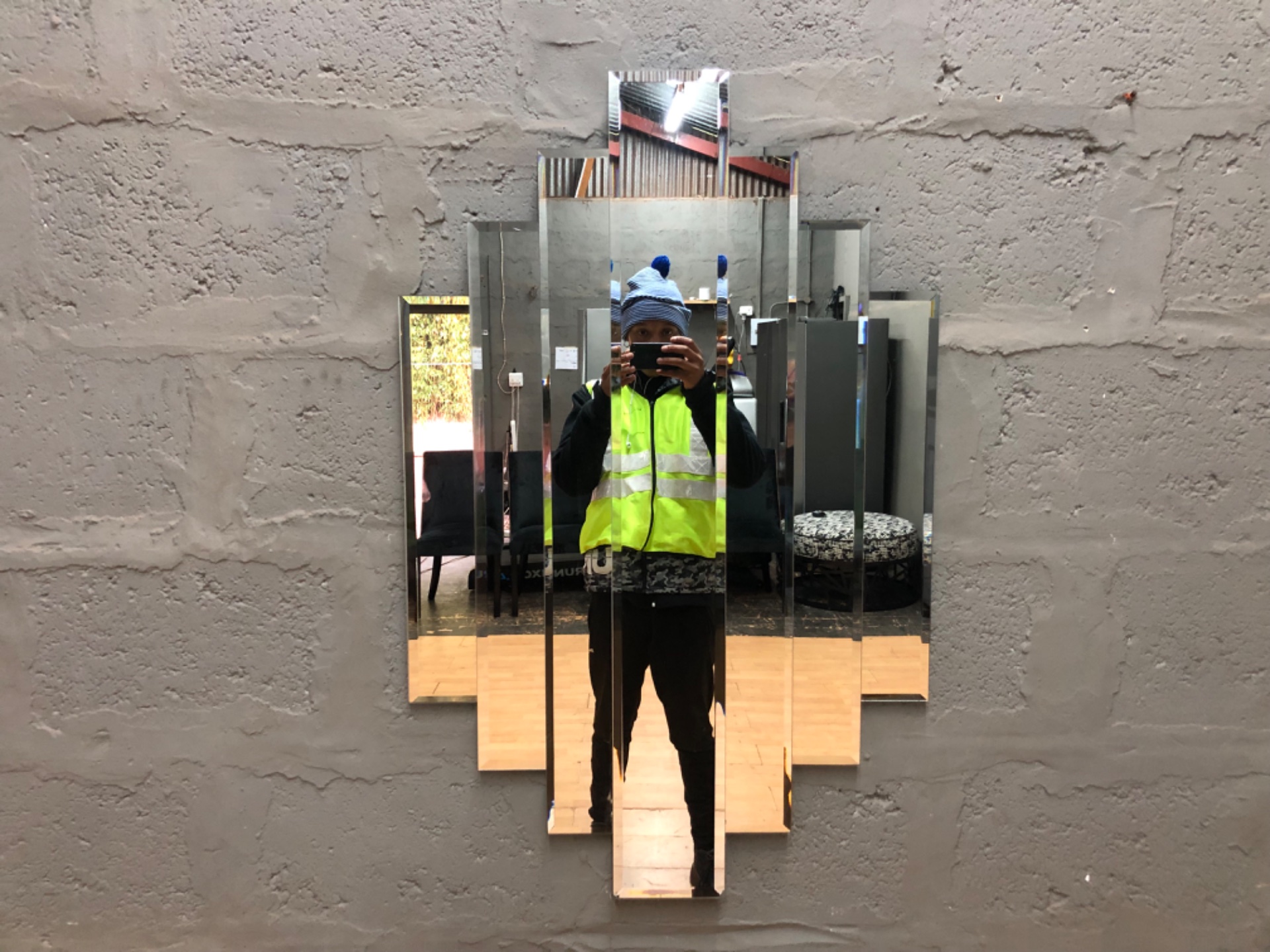 Decorative stepped multi-panel wall mirror — 105 x 66 cm, beveled vertical strips, assembled