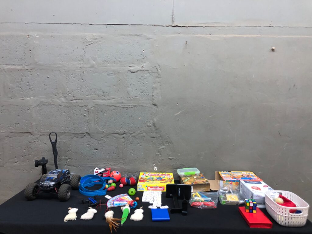 Mixed children’s toys & games bulk lot — RC monster truck, small drone, Rummikub, dominoes, balls & plush