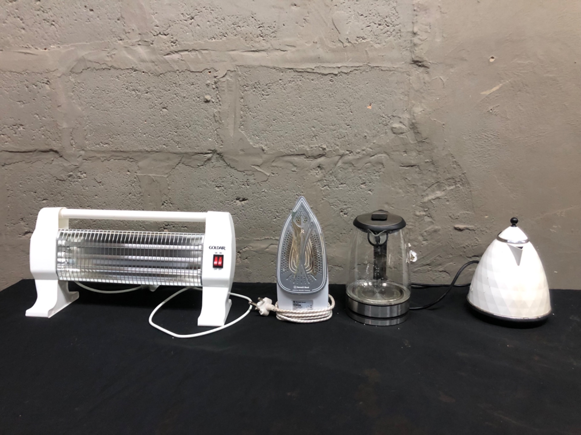 Mixed small countertop appliances — Goldair quartz heater, Bennett Read steam iron, 2 kettles (4 items) — Not working / for repair