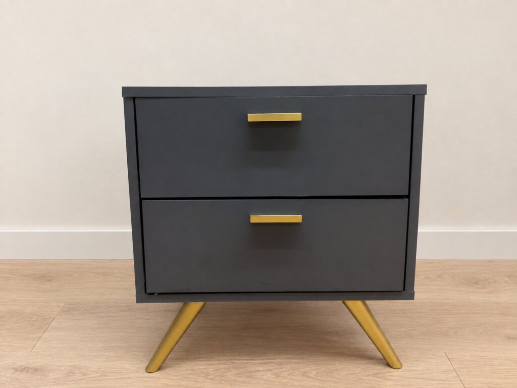Dark-painted two-drawer bedside table / nightstand with gold handles and angled gold legs