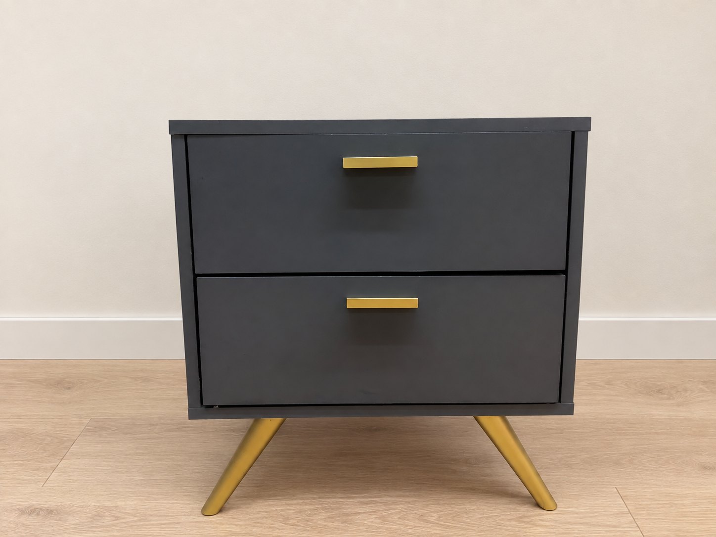 Dark-painted two-drawer bedside table / nightstand with gold handles and angled gold legs
