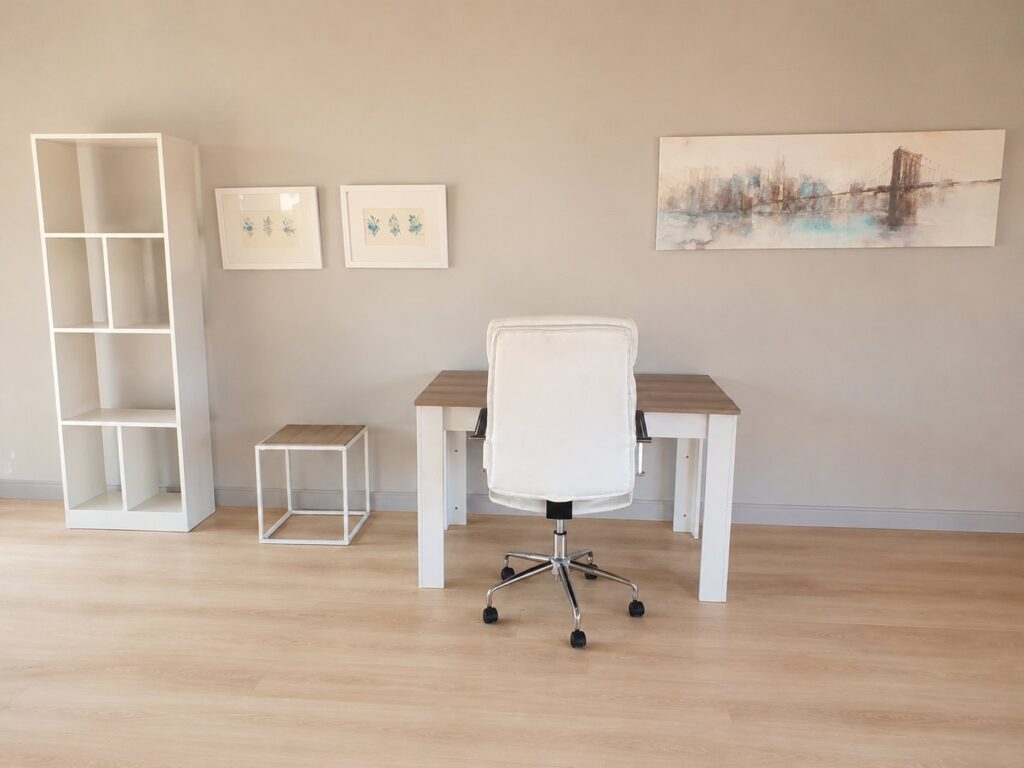 Mixed furniture lot – white faux‑leather swivel office chair, wood‑effect desk, cube side table, bookshelf + framed prints