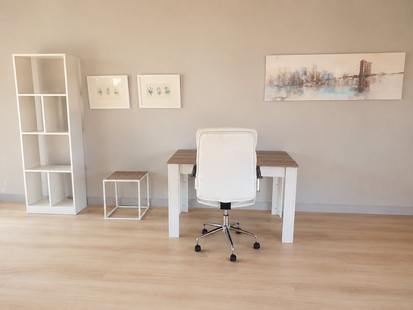 Mixed furniture lot – white faux‑leather swivel office chair, wood‑effect desk, cube side table, bookshelf + framed prints