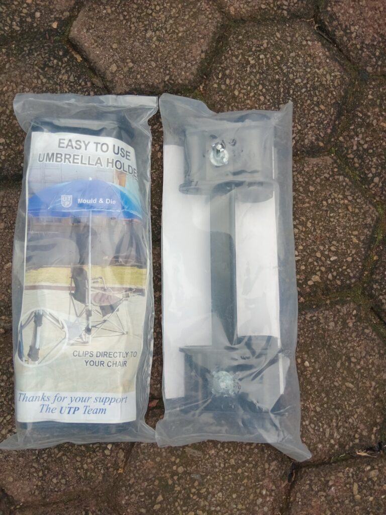 Two clip-on chair umbrella holders — new & sealed (UTP packaging visible)