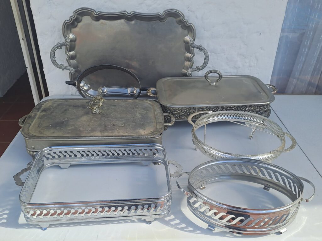 Mixed lot — Assorted stainless‑steel servingware: trays, lidded chafing dishes & pierced stands (no inner pans)