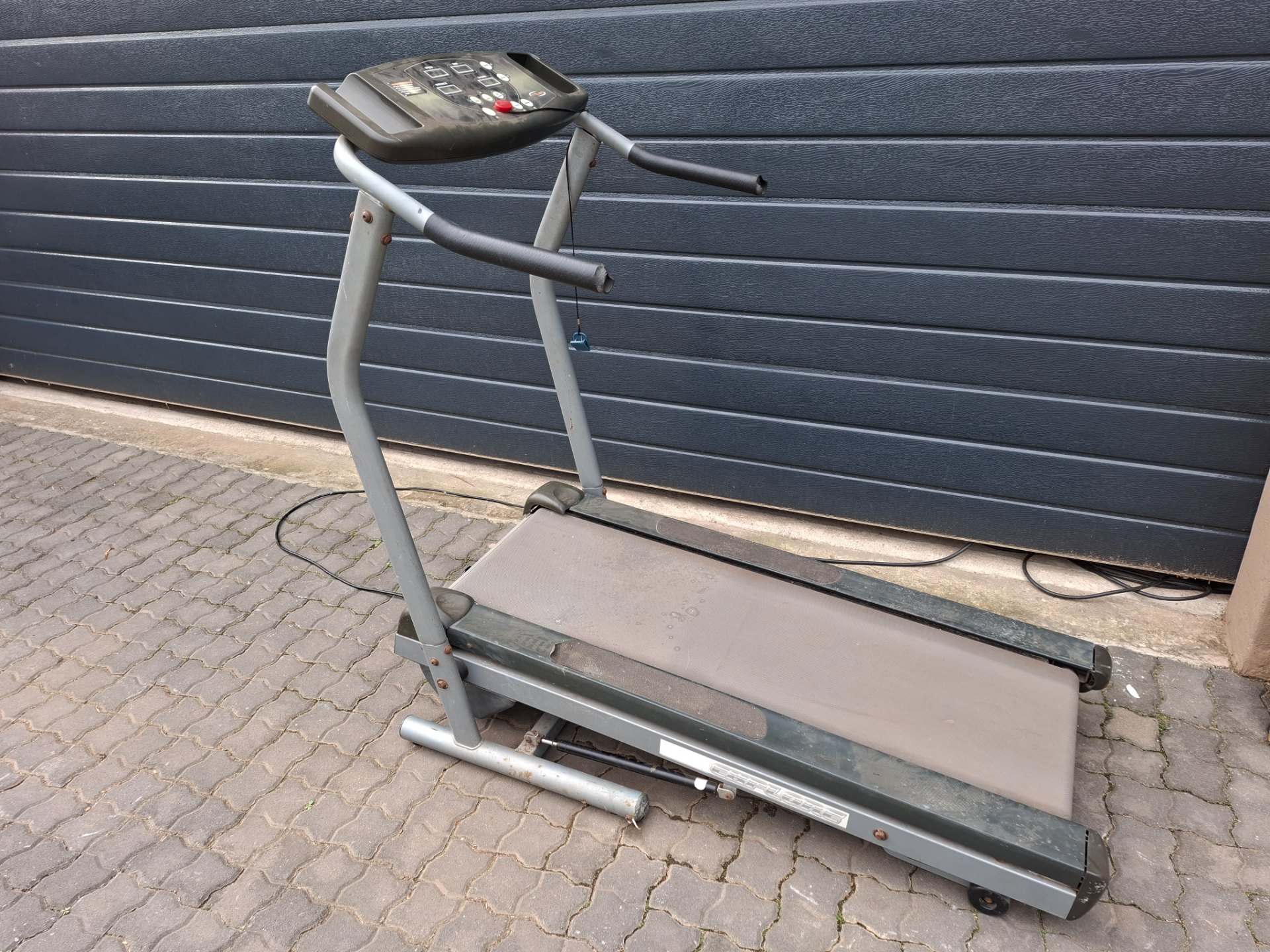 Explore treadmill with Trojan console — belt runs, requires new plug; heavy wear & broken panels