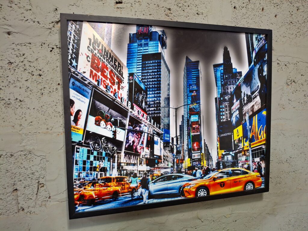 Framed glossy Times Square cityscape print — black frame, ready-to-hang (62 x 53 x 4 cm) — minor scratch