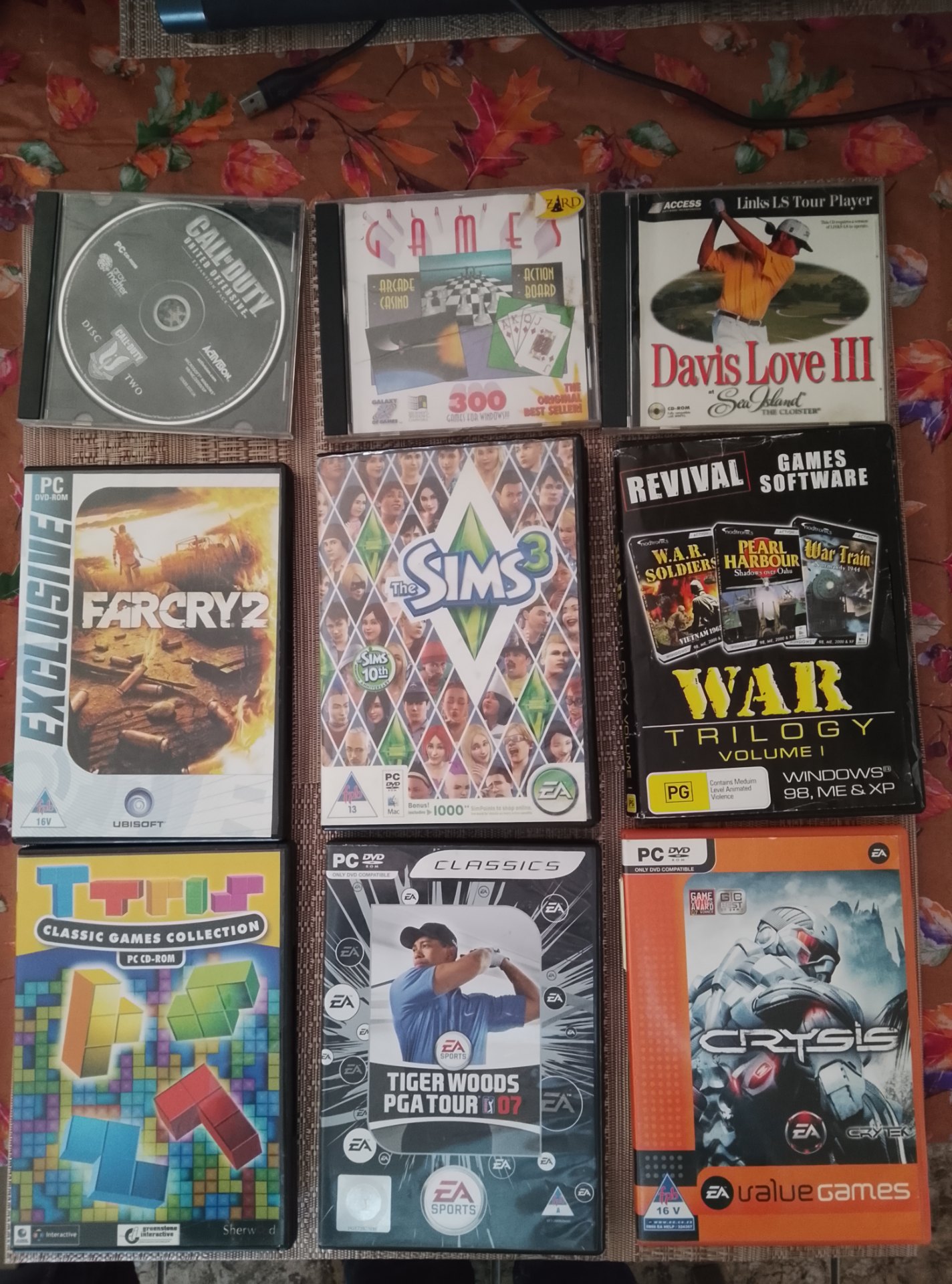 Mixed PC Game Lot – 9 titles (Far Cry 2, The Sims 3, Crysis, Tiger Woods PGA Tour 07, War Trilogy and more)