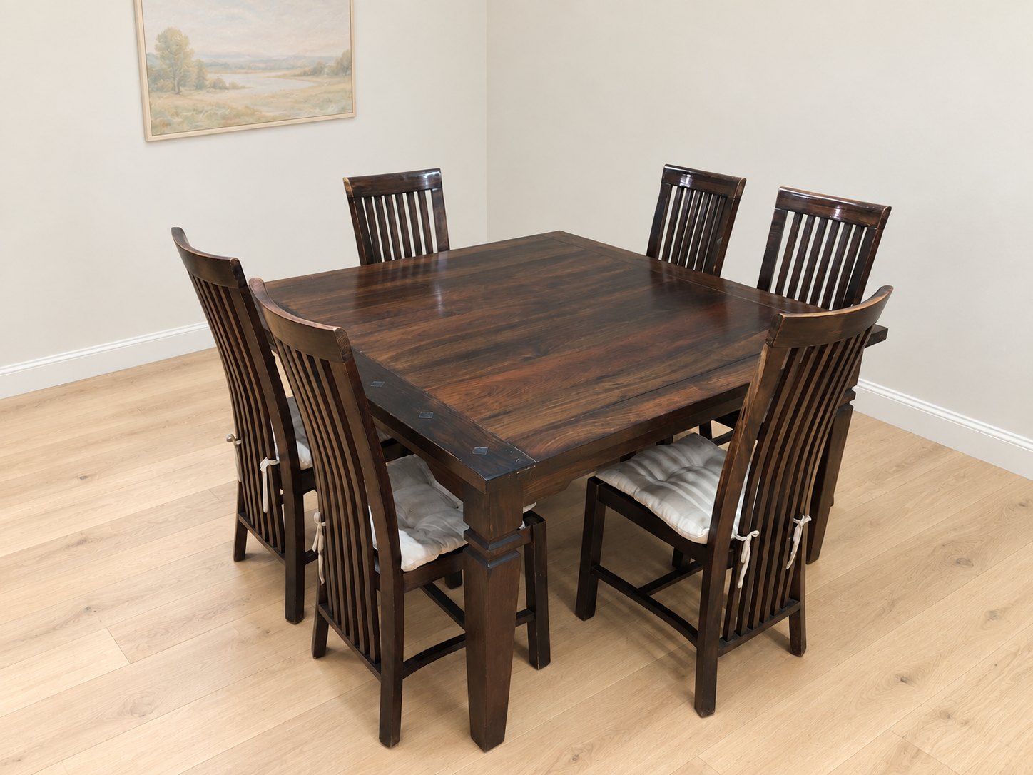 Dark-stained 6-seater dining table with six slatted-back chairs + cream cushions