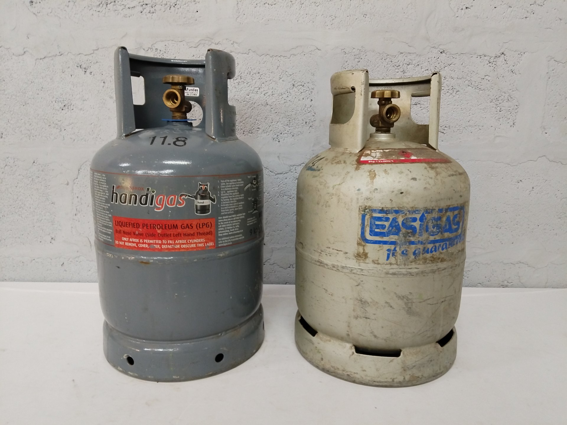 Pair of used LPG cylinders (one HandiGas 9kg) — empty, valves tested to hold, regulator included
