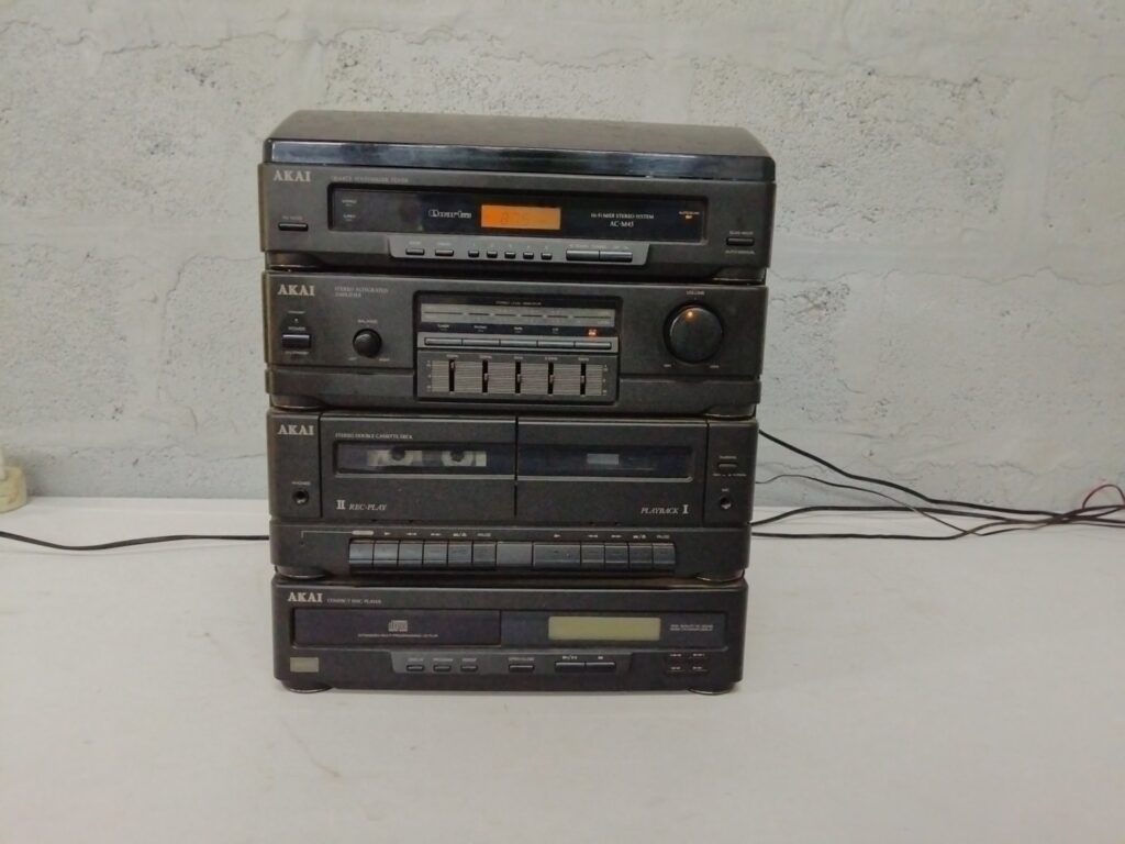 AKAI stacked Hi‑Fi system (AC‑M45 tuner) — tuner, amp, CD, double cassette & turntable