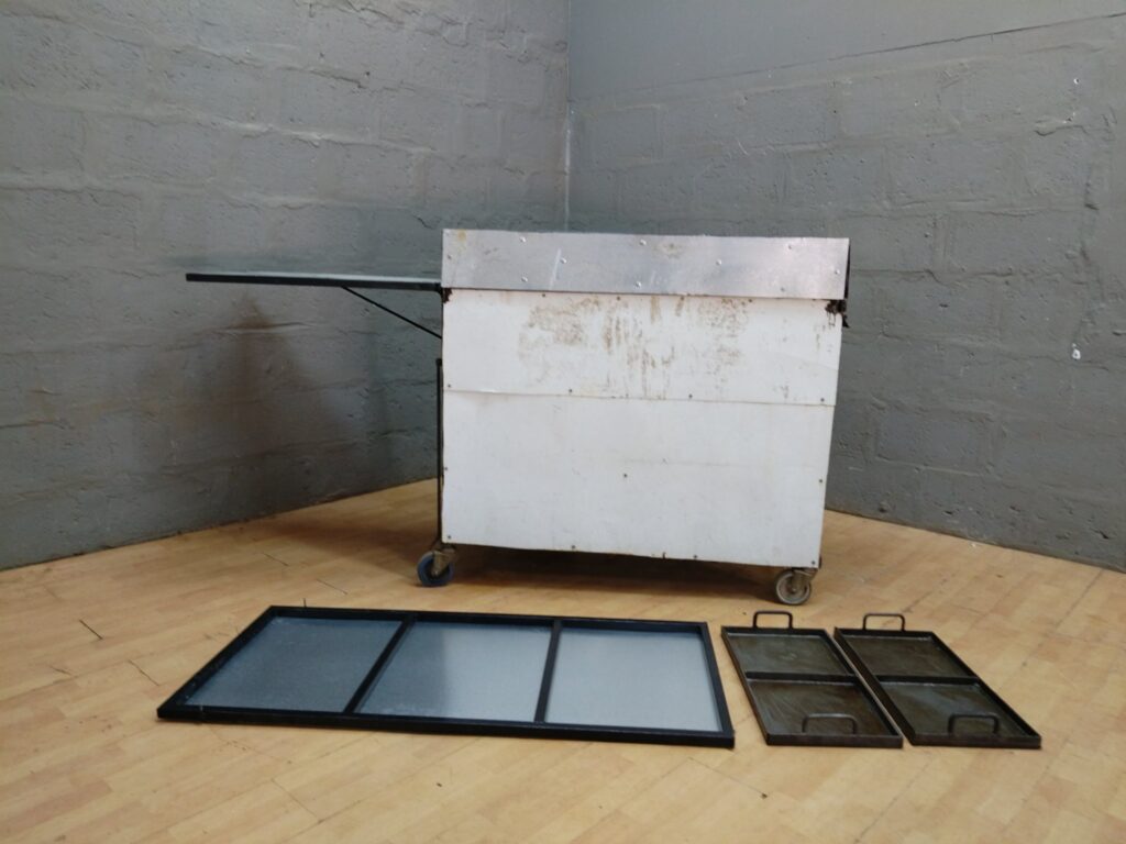 Mobile two‑burner commercial gas griddle cart with removable plates, hoses & regulator – working